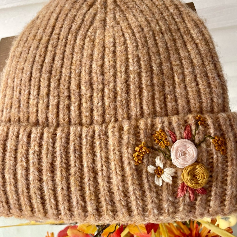 This is a Woman’s Hand Embroidered Knit Beanie.